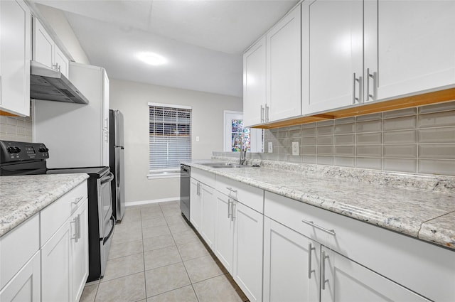 11871 Algonquin Dr, Houston, TX 77089 - kitchen featuring extractor fan, appliances with stainless steel finishes, a sink, white cabinetry, and tasteful backsplash