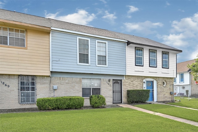 11871 Algonquin Dr, Houston, TX 77089 - townhome / multi-family property with a front yard and brick siding