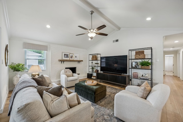 10622 Wickersham Ln, Houston, TX 77042 - living room featuring wood finished floors, a ceiling fan, a brick fireplace, and recessed lighting
