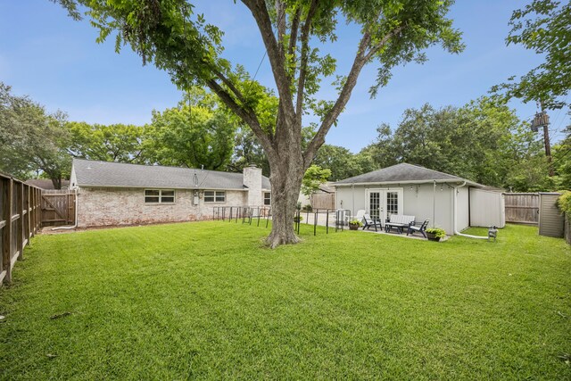 10622 Wickersham Ln, Houston, TX 77042 - view of yard featuring french doors and a patio area