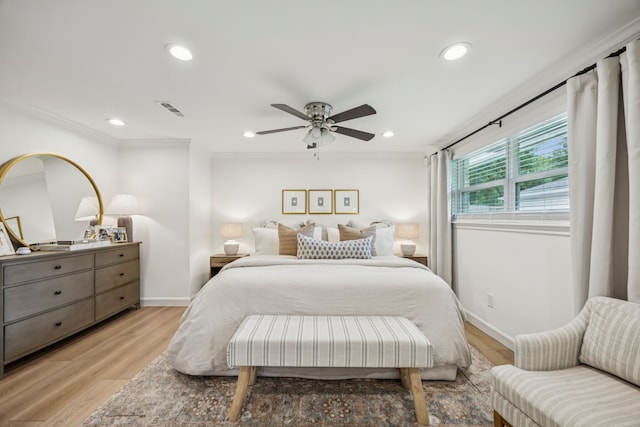 10622 Wickersham Ln, Houston, TX 77042 - bedroom featuring baseboards, light wood-style flooring, recessed lighting, ornamental molding, and ceiling fan