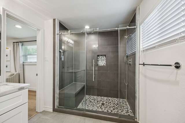 10622 Wickersham Ln, Houston, TX 77042 - full bathroom with a stall shower, vanity, recessed lighting, and tile patterned flooring