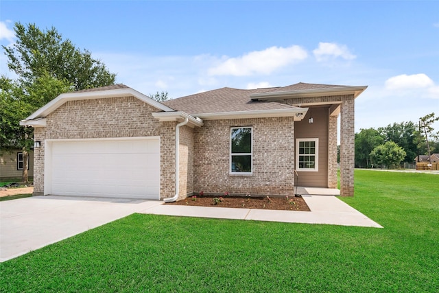 702 Azalea St, Prairie View, TX 77484 - view of front of house with a garage, a front yard, concrete driveway, roof with shingles, and brick siding