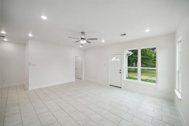 702 Azalea St, Prairie View, TX 77484 - spare room with a ceiling fan, recessed lighting, baseboards, and light tile patterned floors