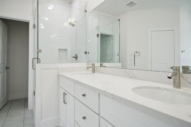 702 Azalea St, Prairie View, TX 77484 - full bath featuring a stall shower, double vanity, and tile patterned flooring