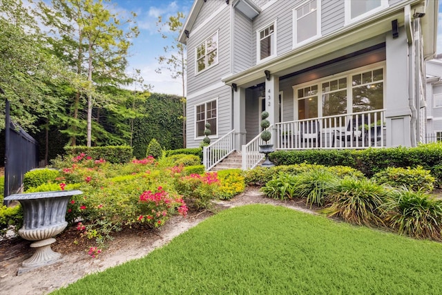 432 Marshall St, Houston, TX 77006 - property entrance featuring a porch and a lawn