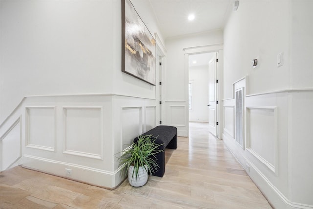 432 Marshall St, Houston, TX 77006 - corridor with a decorative wall, light wood-style floors, a wainscoted wall, and recessed lighting