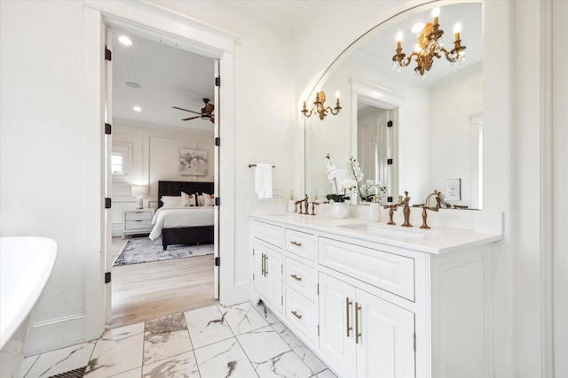 432 Marshall St, Houston, TX 77006 - ensuite bathroom with marble look tiles, double vanity, a chandelier, a freestanding tub, and crown molding