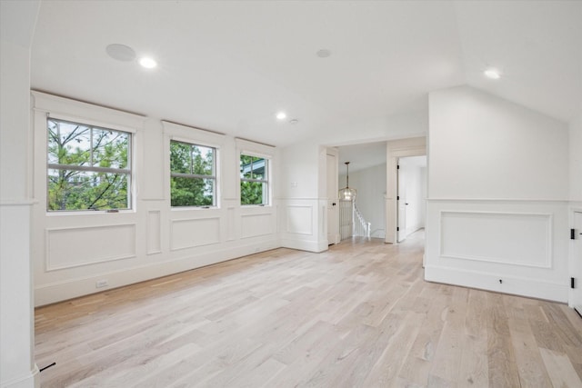 432 Marshall St, Houston, TX 77006 - spare room featuring a decorative wall, lofted ceiling, light wood-type flooring, a wainscoted wall, and recessed lighting