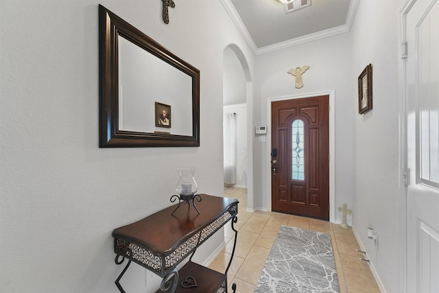 12915 Taper Reach Dr, Tomball, TX 77377 - entryway with ornamental molding, arched walkways, and light tile patterned flooring