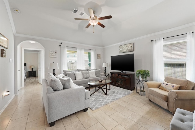 12915 Taper Reach Dr, Tomball, TX 77377 - living room with a ceiling fan, light tile patterned flooring, arched walkways, ornamental molding, and vaulted ceiling