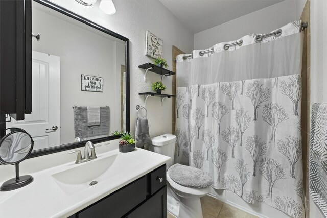 12915 Taper Reach Dr, Tomball, TX 77377 - full bathroom with vanity, tile patterned flooring, shower / bath combo, and a textured wall