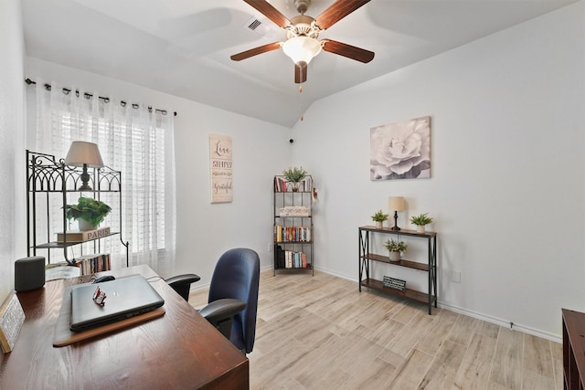 12915 Taper Reach Dr, Tomball, TX 77377 - office featuring a ceiling fan, light wood finished floors, and vaulted ceiling