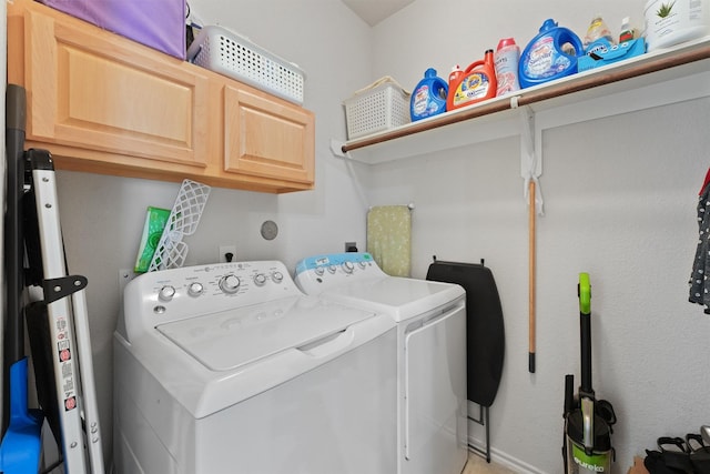12915 Taper Reach Dr, Tomball, TX 77377 - laundry room featuring separate washer and dryer and cabinet space
