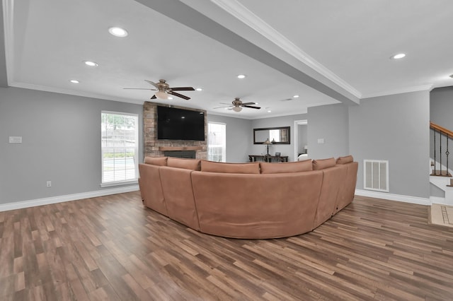 833 Stone Mountain Dr, Conroe, TX 77302 - living room featuring crown molding, wood finished floors, stairs, a fireplace, and recessed lighting
