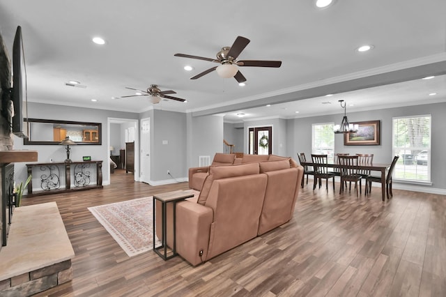 833 Stone Mountain Dr, Conroe, TX 77302 - living area with recessed lighting, wood finished floors, baseboards, ceiling fan, and crown molding