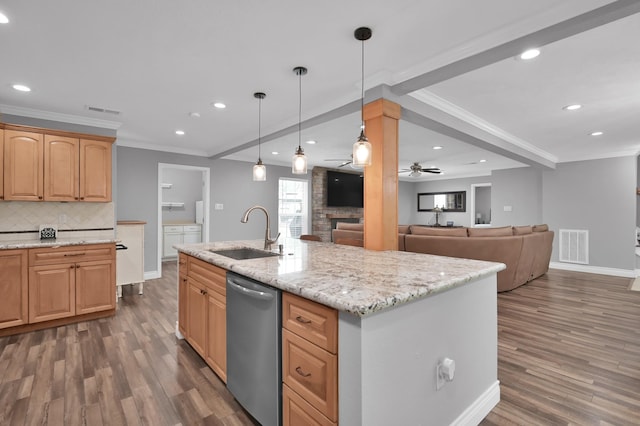 833 Stone Mountain Dr, Conroe, TX 77302 - kitchen featuring a sink, stainless steel dishwasher, wood finished floors, baseboards, and backsplash