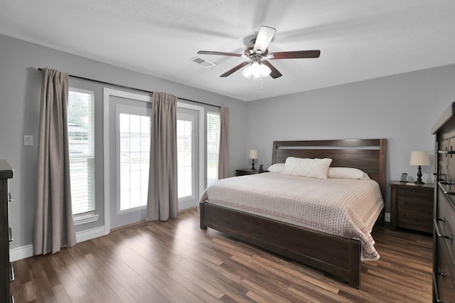 833 Stone Mountain Dr, Conroe, TX 77302 - bedroom with access to outside, dark wood-type flooring, a ceiling fan, and baseboards
