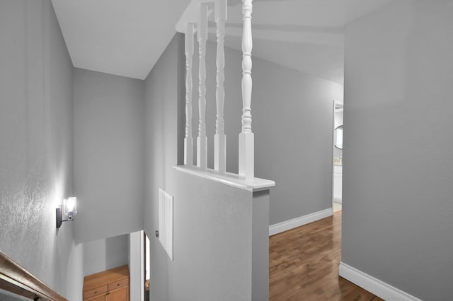 833 Stone Mountain Dr, Conroe, TX 77302 - stairs featuring baseboards and wood finished floors