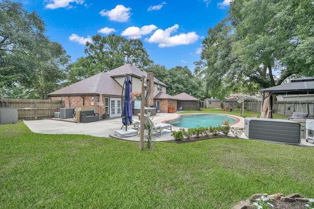 833 Stone Mountain Dr, Conroe, TX 77302 - back of property with a gazebo, french doors, a patio area, brick siding, and cooling unit