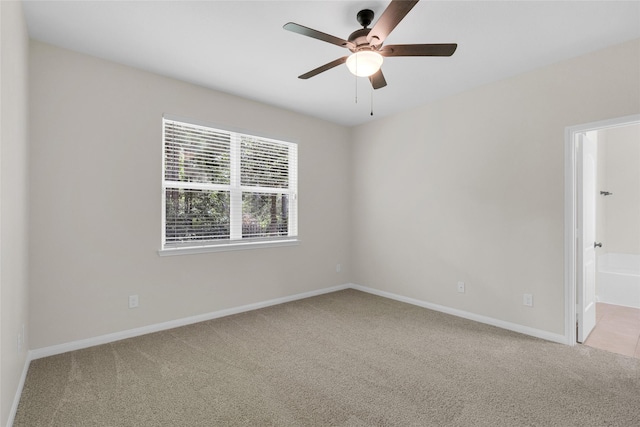 7571 Fettle Ln, Conroe, TX 77304 - empty room featuring carpet, ceiling fan, and baseboards