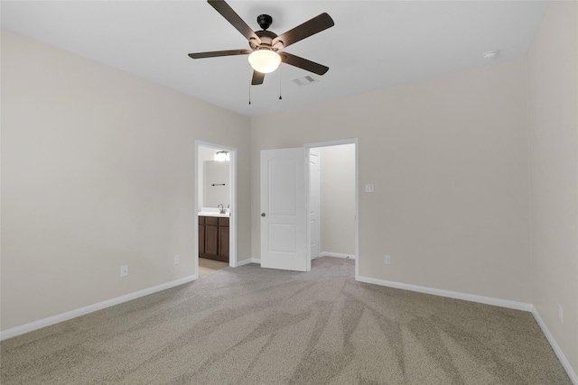 7571 Fettle Ln, Conroe, TX 77304 - spare room with ceiling fan, light carpet, a sink, and baseboards