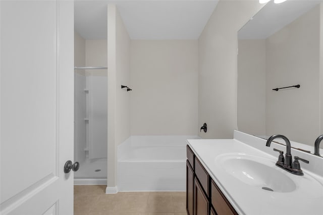 7571 Fettle Ln, Conroe, TX 77304 - bathroom featuring vanity, a garden tub, tile patterned flooring, and a shower