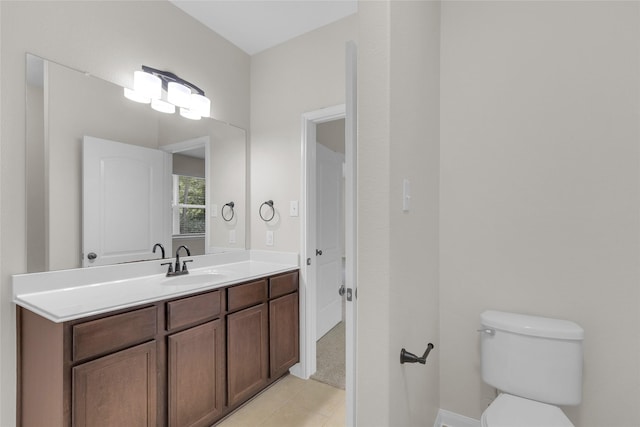 7571 Fettle Ln, Conroe, TX 77304 - bathroom with tile patterned flooring, toilet, vanity, and baseboards