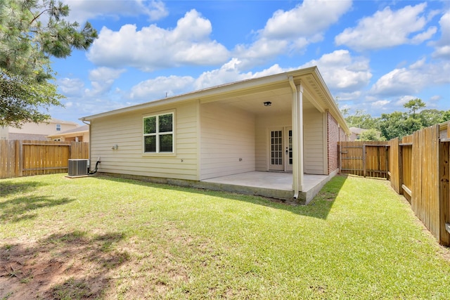 7571 Fettle Ln, Conroe, TX 77304 - back of property with a patio area, french doors, and cooling unit