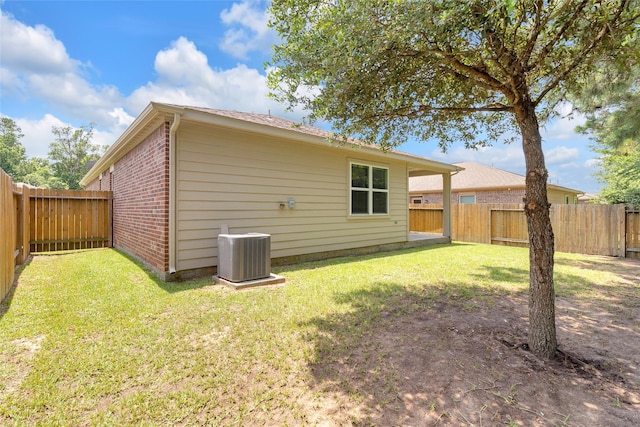 7571 Fettle Ln, Conroe, TX 77304 - back of property with cooling unit and brick siding