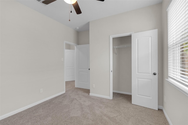 7571 Fettle Ln, Conroe, TX 77304 - unfurnished bedroom with light colored carpet, a closet, baseboards, and a ceiling fan