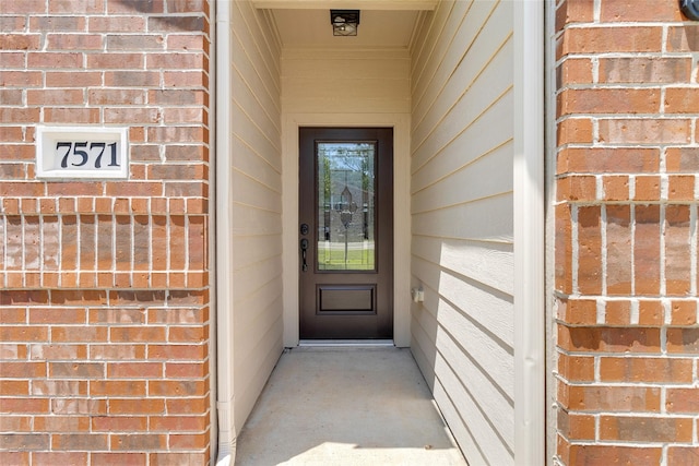 7571 Fettle Ln, Conroe, TX 77304 - view of exterior entry with brick siding