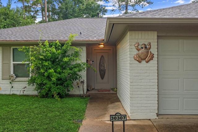 30307 Thorsby Dr, Spring, TX 77386 - property entrance featuring roof with shingles, a garage, a lawn, and brick siding