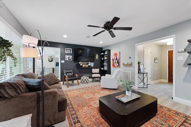 30307 Thorsby Dr, Spring, TX 77386 - living area featuring light wood-style floors, ceiling fan, recessed lighting, and baseboards