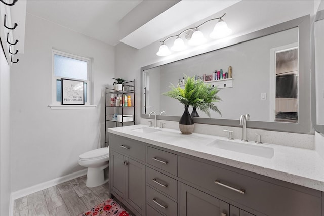 30307 Thorsby Dr, Spring, TX 77386 - full bath featuring double vanity, toilet, and baseboards