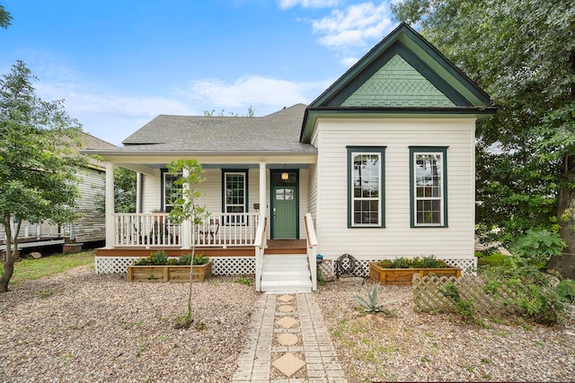 2019 Crockett St, Houston, TX 77007 - view of front of home with covered porch and a shingled roof