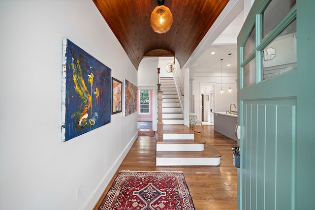 2019 Crockett St, Houston, TX 77007 - foyer entrance with wood ceiling, hardwood / wood-style flooring, lofted ceiling, stairs, and baseboards