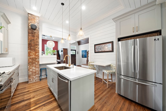 2019 Crockett St, Houston, TX 77007 - kitchen featuring stainless steel appliances, a sink, hardwood / wood-style floors, ornamental molding, and wooden ceiling