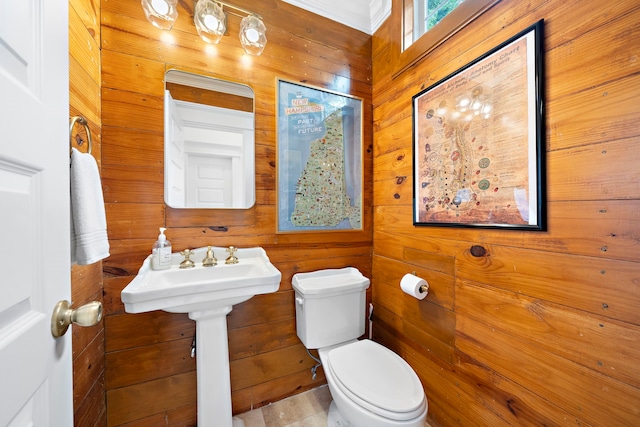 2019 Crockett St, Houston, TX 77007 - bathroom featuring toilet and wooden walls