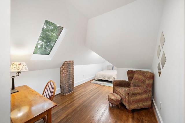2019 Crockett St, Houston, TX 77007 - bedroom with lofted ceiling, wood finished floors, baseboards, and a skylight