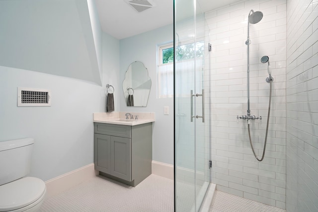 2019 Crockett St, Houston, TX 77007 - bathroom with toilet, vanity, a stall shower, and tile patterned floors