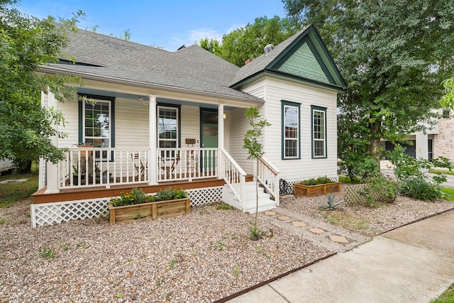 2019 Crockett St, Houston, TX 77007 - view of front of property with covered porch and a shingled roof