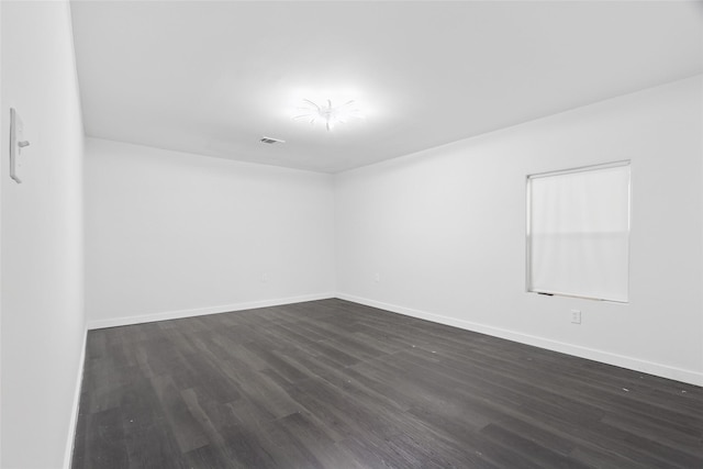 5614 Malmedy Rd, Houston, TX 77033 - empty room featuring dark wood-style flooring and baseboards