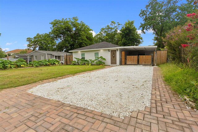 5614 Malmedy Rd, Houston, TX 77033 - ranch-style home featuring gravel driveway and a gate