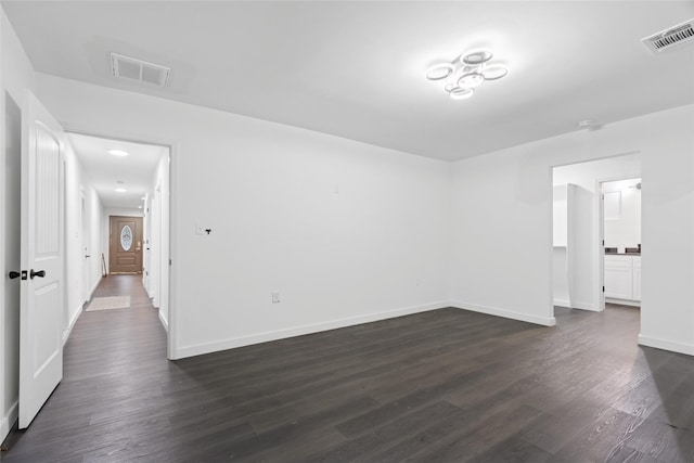 5614 Malmedy Rd, Houston, TX 77033 - unfurnished room with dark wood-type flooring and baseboards