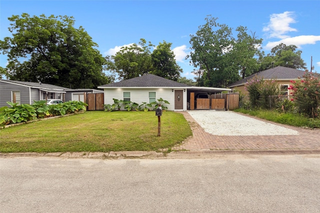5614 Malmedy Rd, Houston, TX 77033 - single story home featuring driveway, a gate, and an attached carport