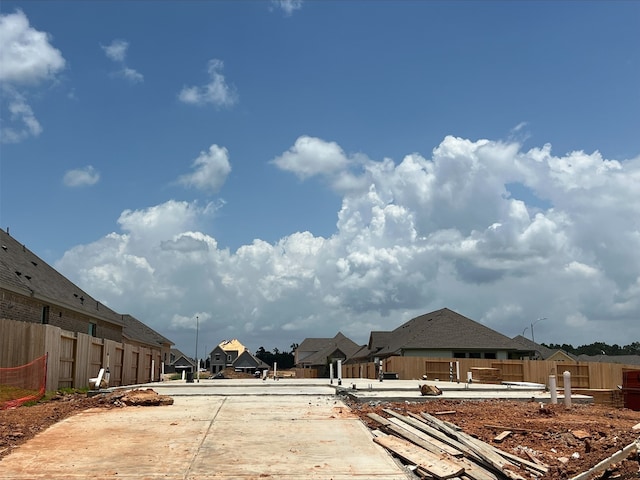 42616 Mystery Ln, Magnolia, TX 77354 - view of concrete road featuring a residential view and street lights