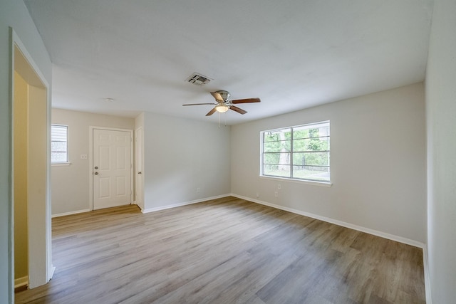 11063 Vailview Dr, Houston, TX 77016 - spare room with plenty of natural light, wood finished floors, a ceiling fan, and baseboards