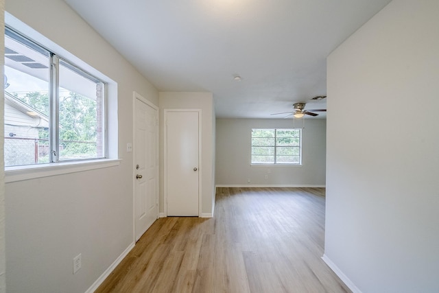 11063 Vailview Dr, Houston, TX 77016 - empty room with light wood-style floors, baseboards, and ceiling fan