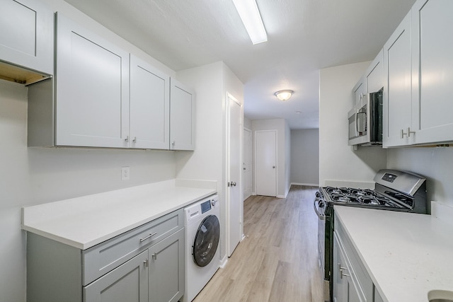 11063 Vailview Dr, Houston, TX 77016 - washroom featuring washer / clothes dryer, light wood finished floors, and baseboards